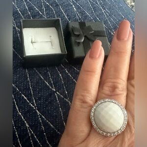 White enamel and silver ring with pave set clear simulated gemstones.